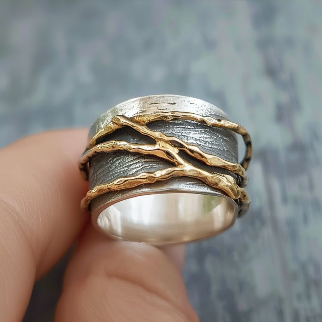 Anello intrecciato in argento e oro