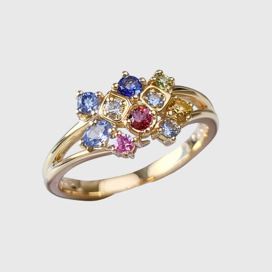 Anello dorato con cristallo colorato
