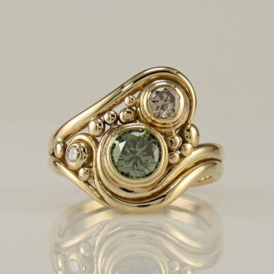 Anello vintage dorato con zirconia verde